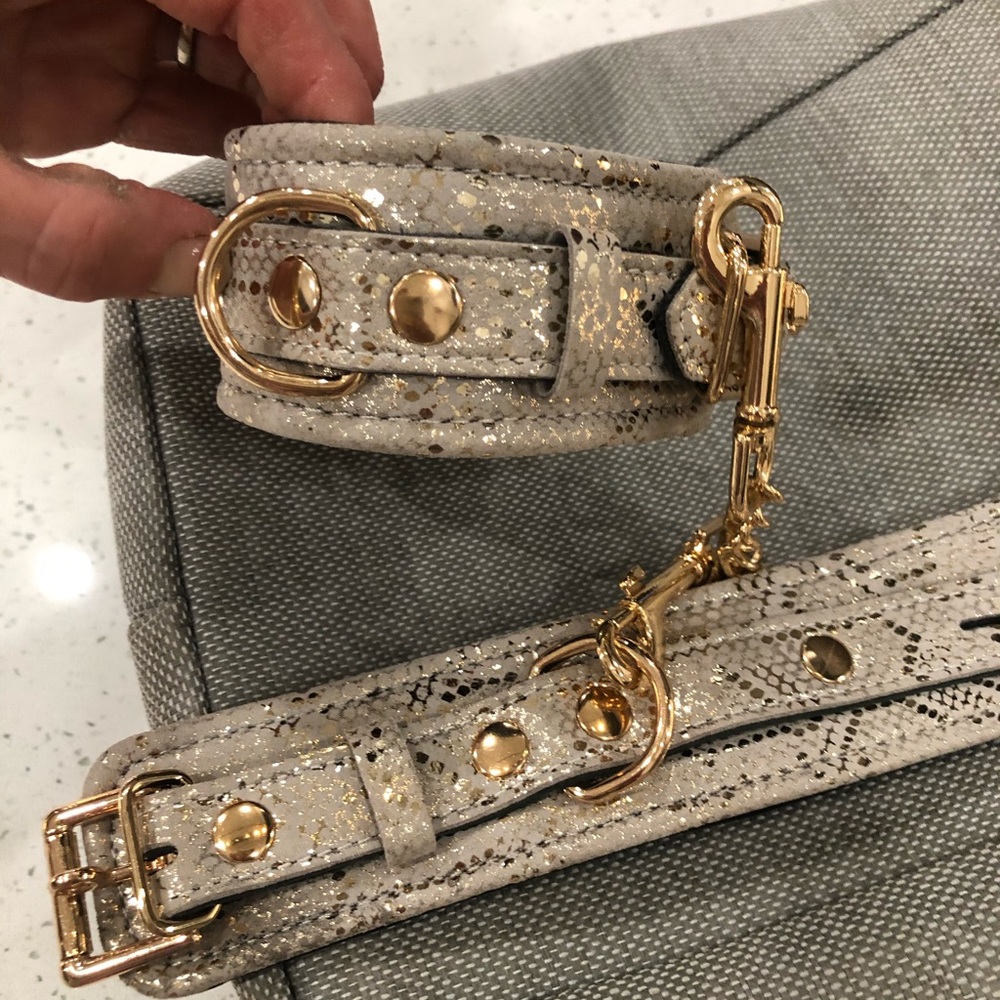 Gold handcuffs never been used. It’s a steal